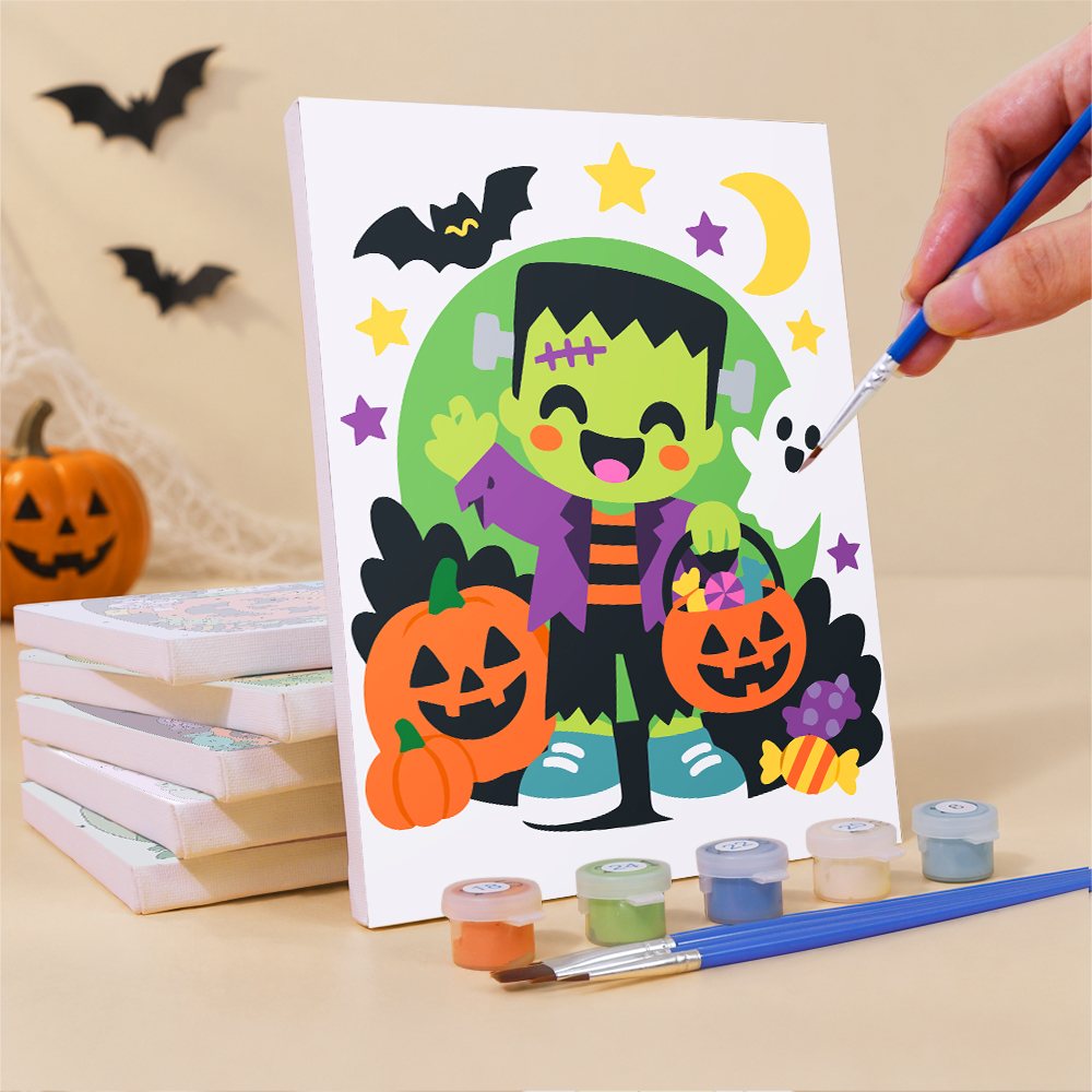 Painting a Bright Halloween Buddies mini canvas propped up beside numbered acrylic paints