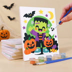 Painting a Bright Halloween Buddies mini canvas propped up beside numbered acrylic paints