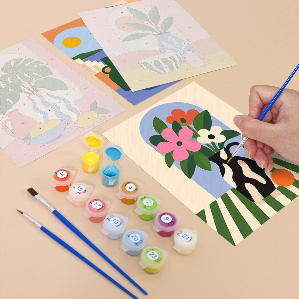 Filling in a Bright Interiors mini canvas with numbered acrylic paints and a fine brush