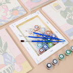 Numbered paint pots and brushes on a pre-stretched Bright Interiors mini canvas