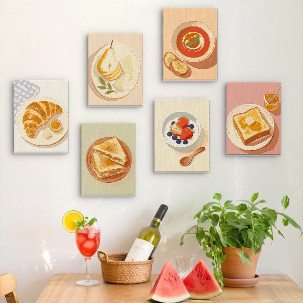 Six finished Brunch Club mini paintings hung on a wall above a table