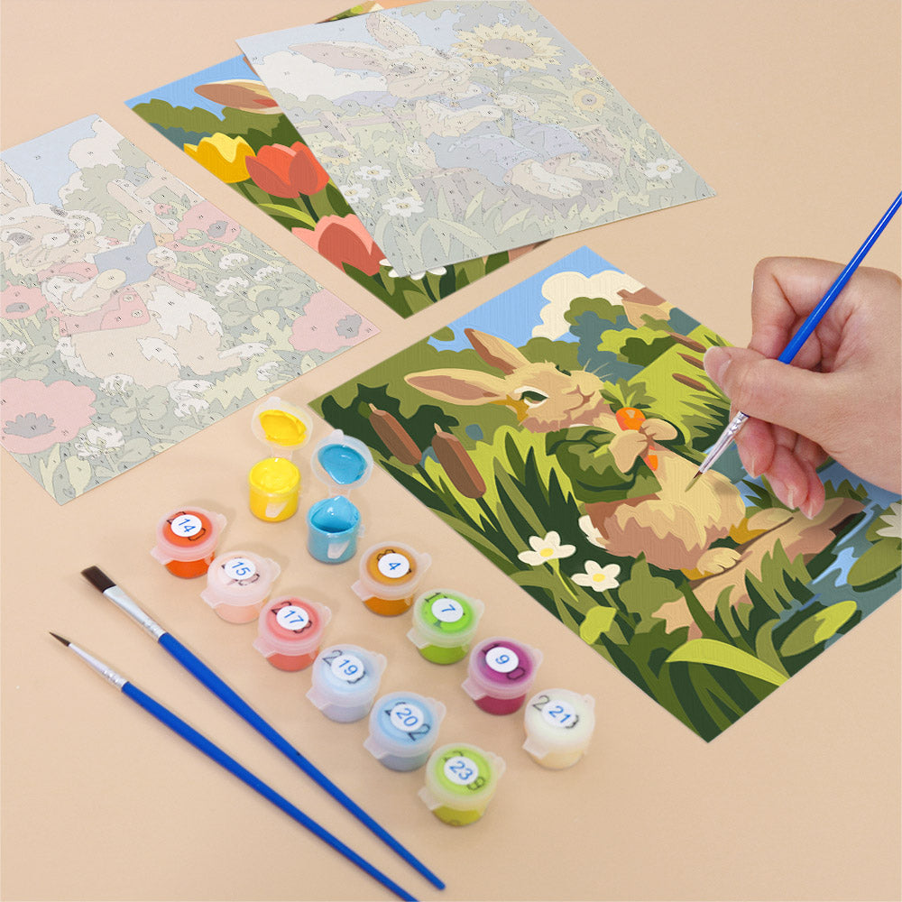 Filling in a Bunny Garden mini canvas with numbered acrylic paints and a fine brush