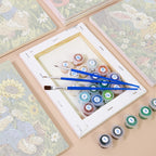 Numbered paint pots and brushes on a pre-stretched Bunny Garden mini canvas