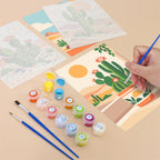 Filling in a Cactus Country mini canvas with numbered acrylic paints and a fine brush