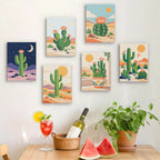 Six finished Cactus Country mini paintings hung on a wall above a table