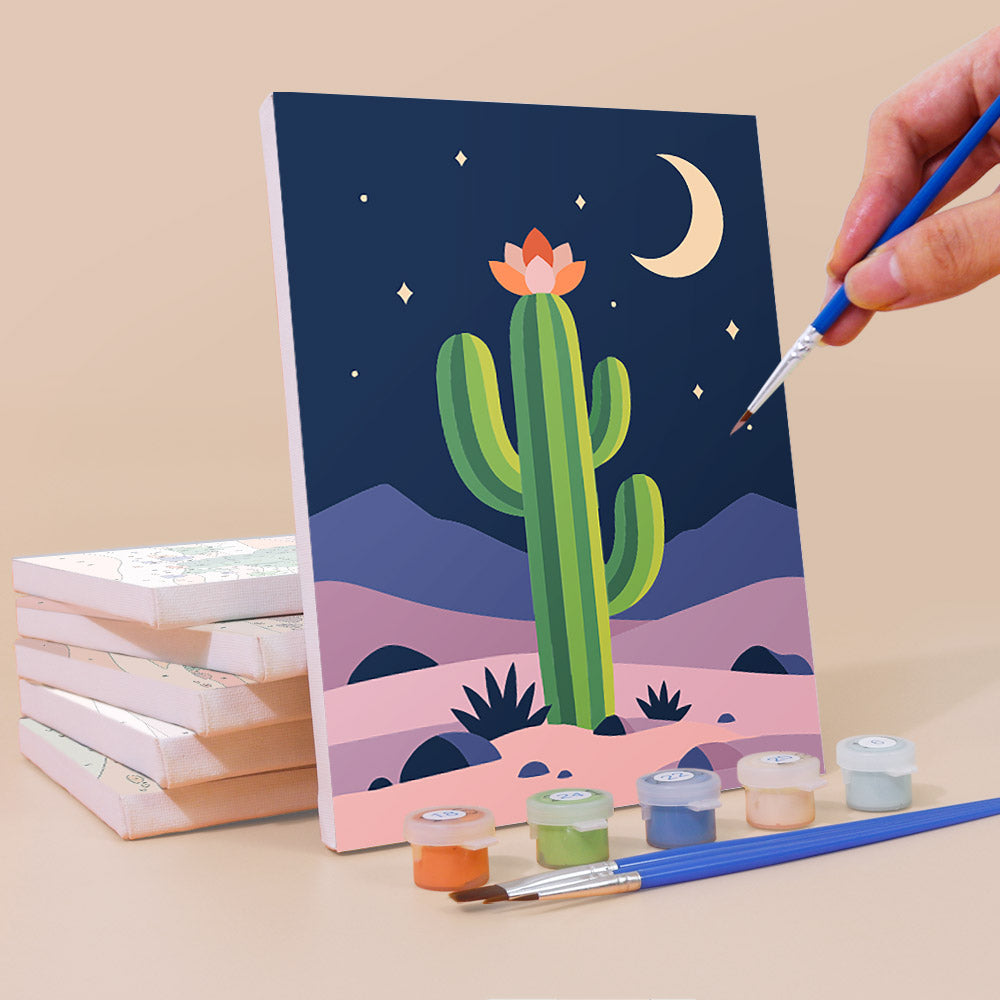 Painting a Cactus Country mini canvas propped up beside numbered acrylic paints