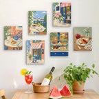 Six finished Café Mornings mini paintings hung on a wall above a table