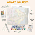 What's included in the Canal of Dreams paint by numbers kit: numbered linen canvas, reference sheet, color guide, 24 acrylic paints, 3 brushes and thank you card