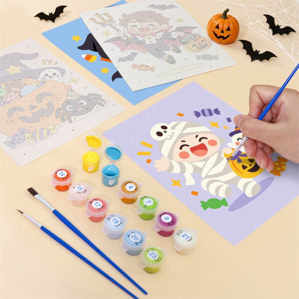 Filling in a Candy Corn Chibis mini canvas with numbered acrylic paints and a fine brush
