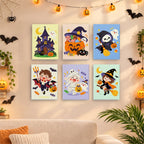 Six finished Candy Corn Chibis mini paintings hung on a wall above a table