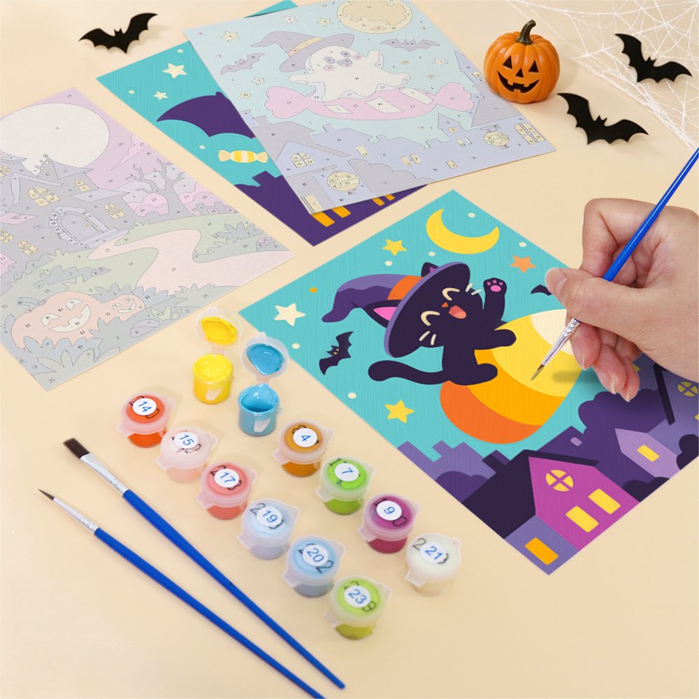Filling in a Candy Sky Halloween mini canvas with numbered acrylic paints and a fine brush