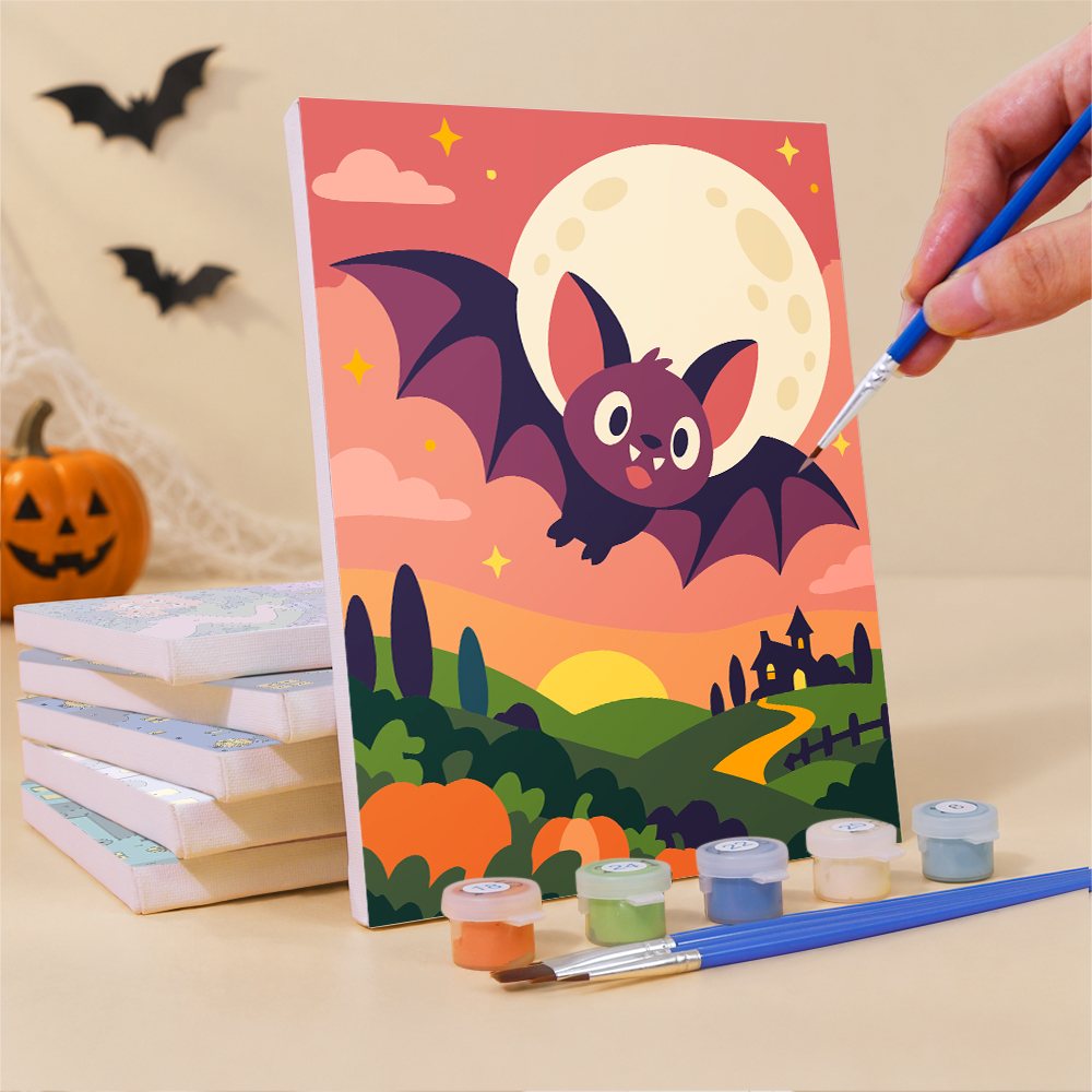 Painting a Candy Sky Halloween mini canvas propped up beside numbered acrylic paints