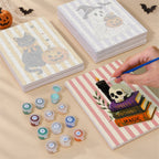 Painting one of the Candy Stripe Spooks designs next to a stack of mini canvases
