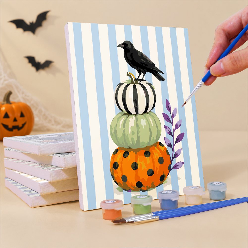 Painting a Candy Stripe Spooks mini canvas propped up beside numbered acrylic paints