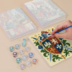 Painting one of the Castles & Knights designs next to a stack of mini canvases