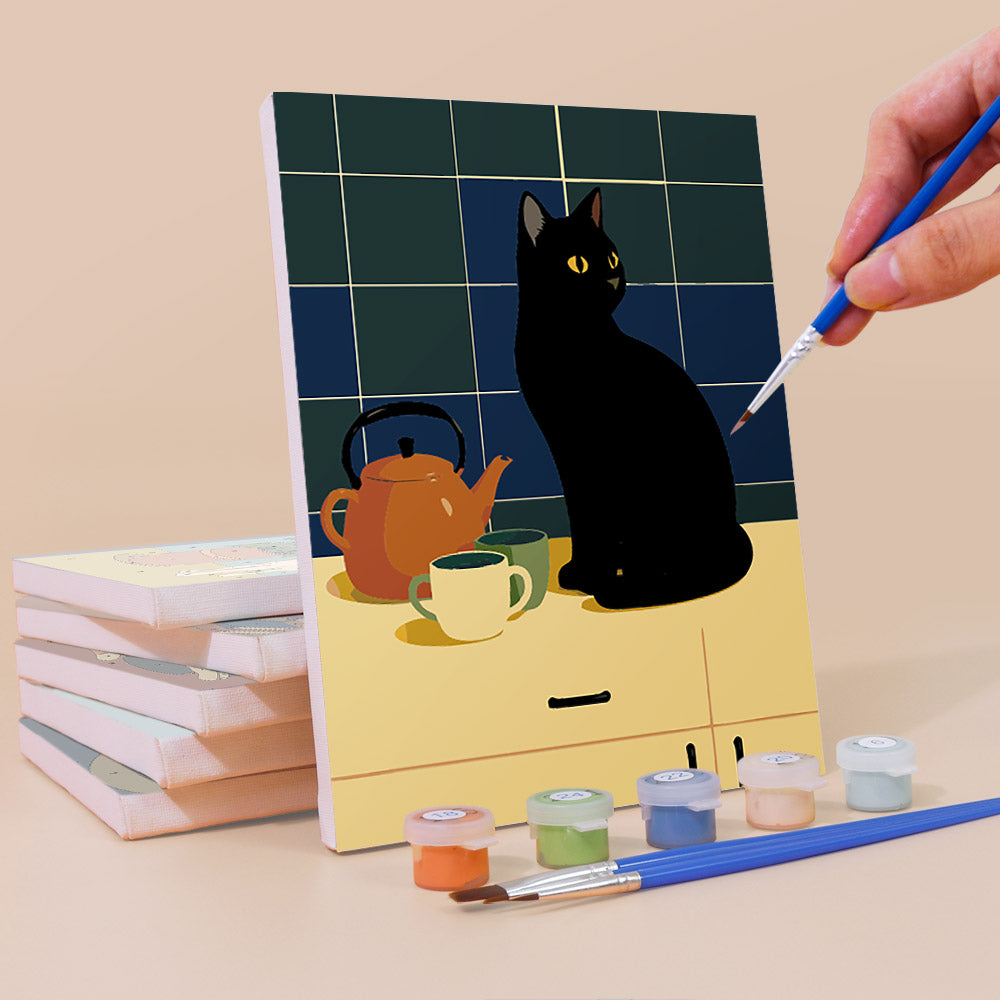 Painting a Cats at Home mini canvas propped up beside numbered acrylic paints
