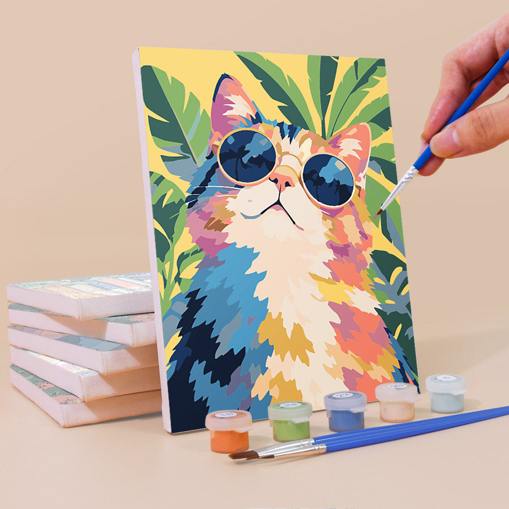 Painting a Cats in Bloom mini canvas propped up beside numbered acrylic paints