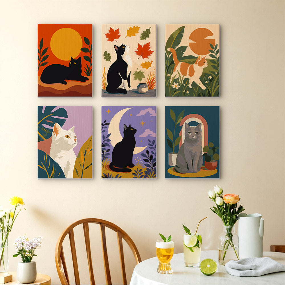 Cats Through the Seasons mini paintings displayed as a gallery wall in a sunny kitchen