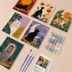 Cats Through the Seasons mini paint by numbers kit with six numbered canvases, acrylic paints, brushes and layout