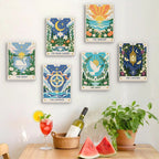 Six finished Celestial Cards mini paintings hung on a wall above a table