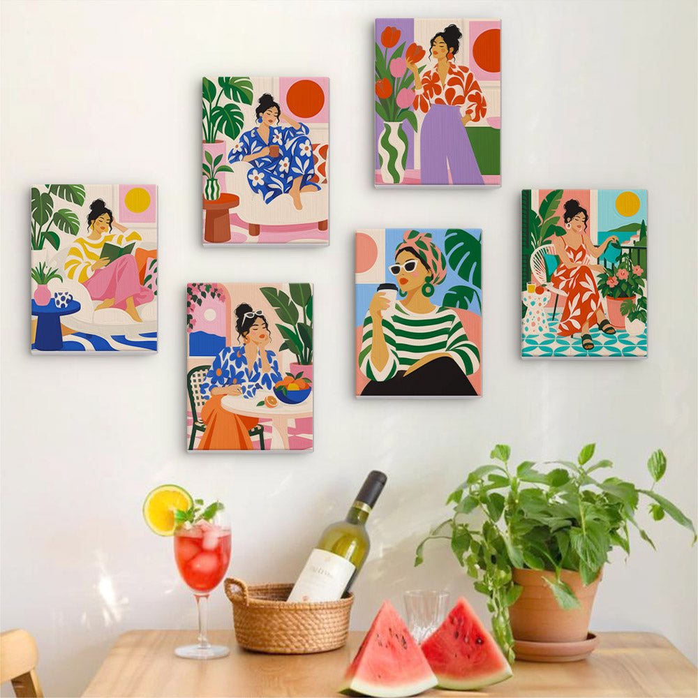 Six finished Chic at Home mini paintings hung on a wall above a table