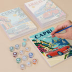 Painting one of the Classic Car Getaways designs next to a stack of mini canvases