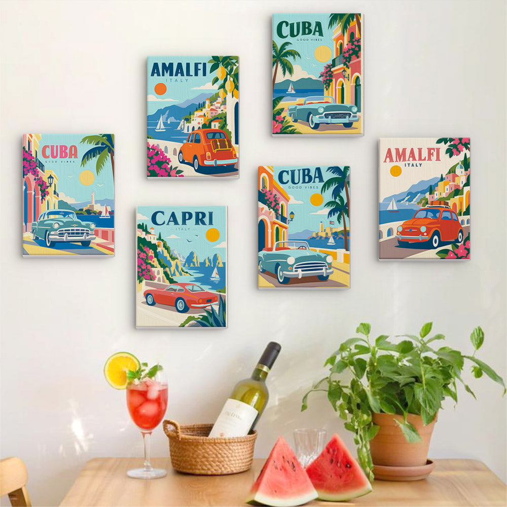 Six finished Classic Car Getaways mini paintings hung on a wall above a table