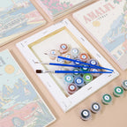 Numbered paint pots and brushes on a pre-stretched Classic Car Getaways mini canvas