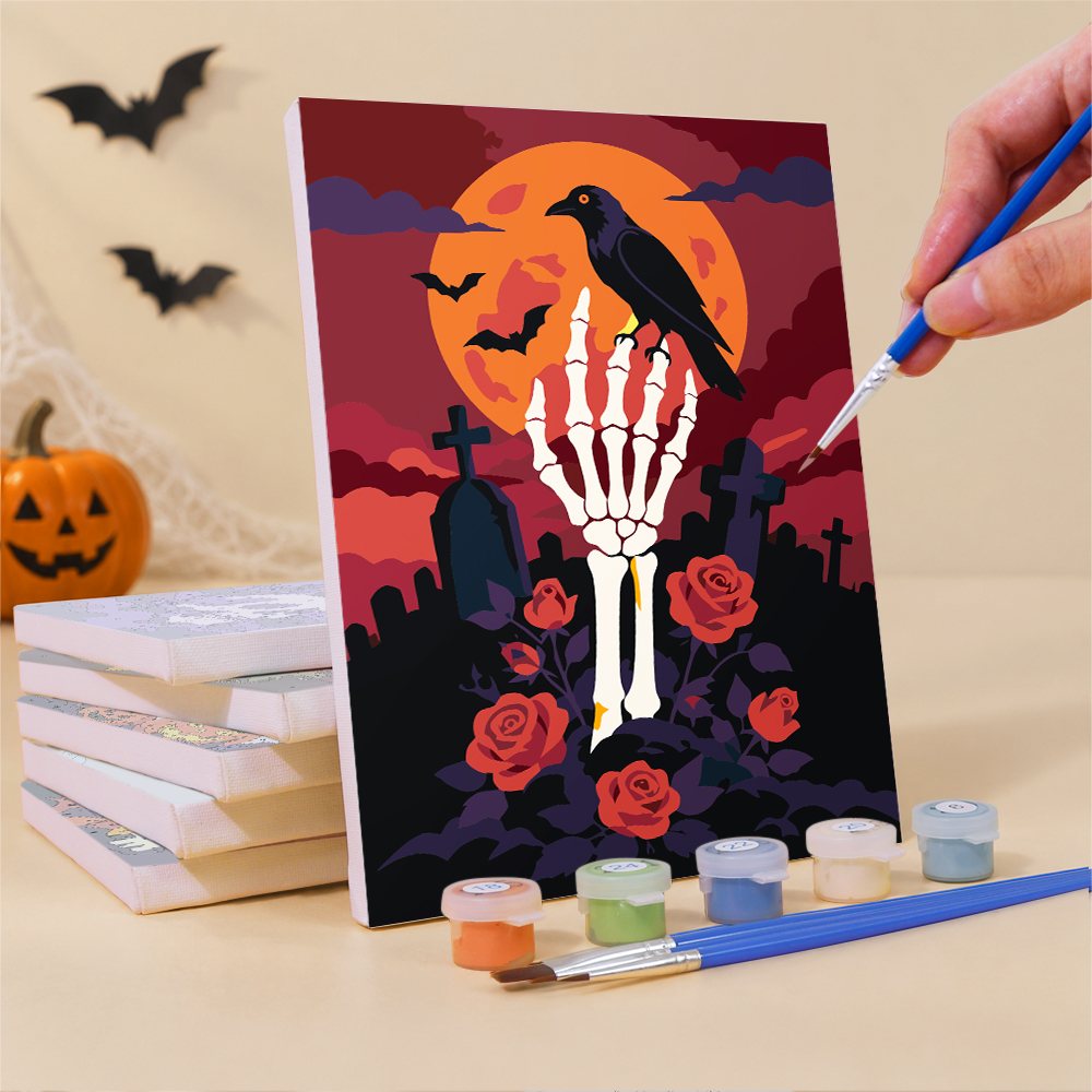 Painting a Classic Spooky Nights mini canvas propped up beside numbered acrylic paints