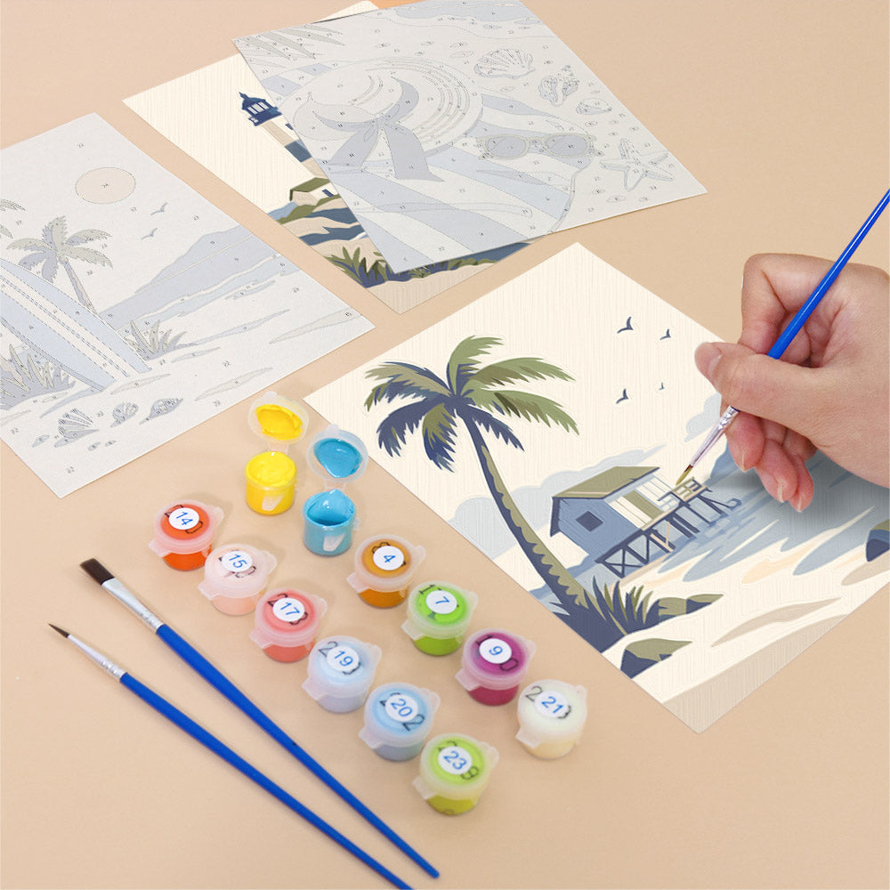 Filling in a Coastal Blues mini canvas with numbered acrylic paints and a fine brush