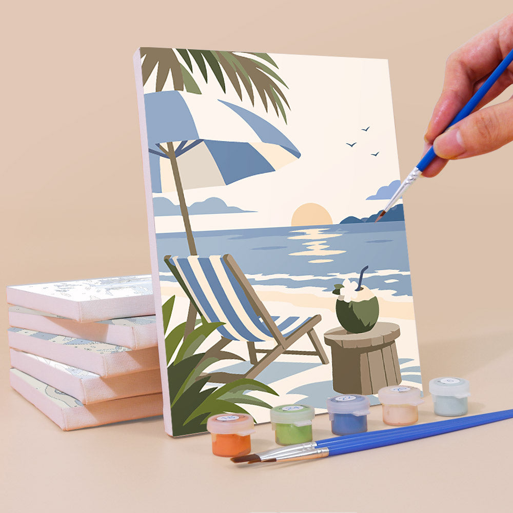 Painting a Coastal Blues mini canvas propped up beside numbered acrylic paints