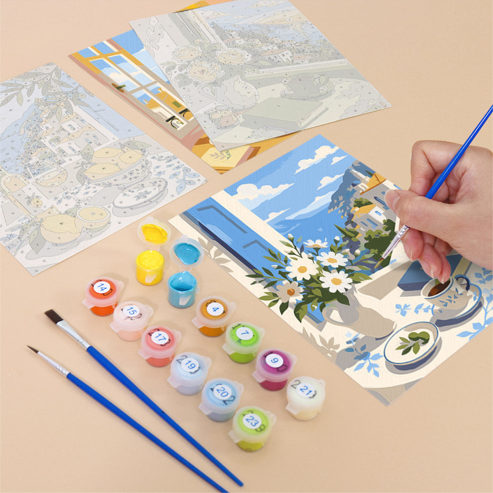 Filling in a Coastal Breakfast mini canvas with numbered acrylic paints and a fine brush
