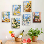 Six finished Coastal Breakfast mini paintings hung on a wall above a table