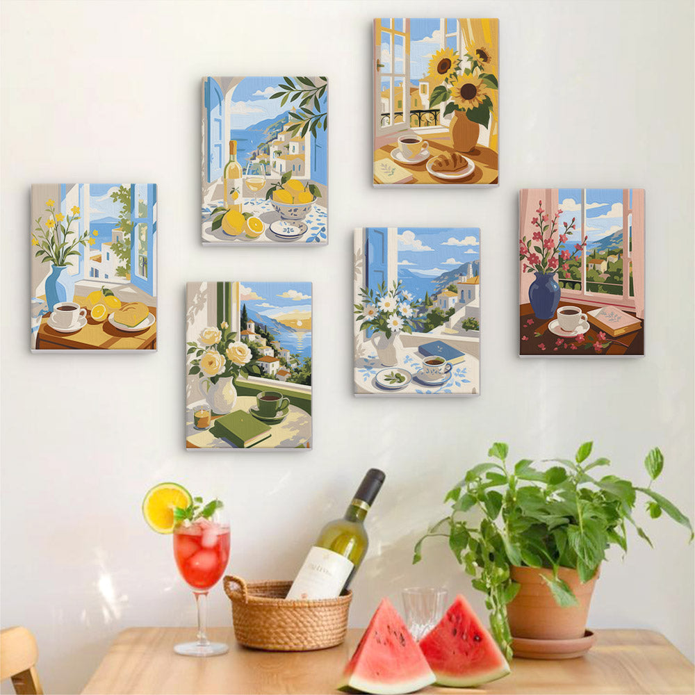 Six finished Coastal Breakfast mini paintings hung on a wall above a table