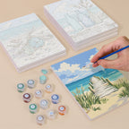 Painting one of the Coastal Whites designs next to a stack of mini canvases