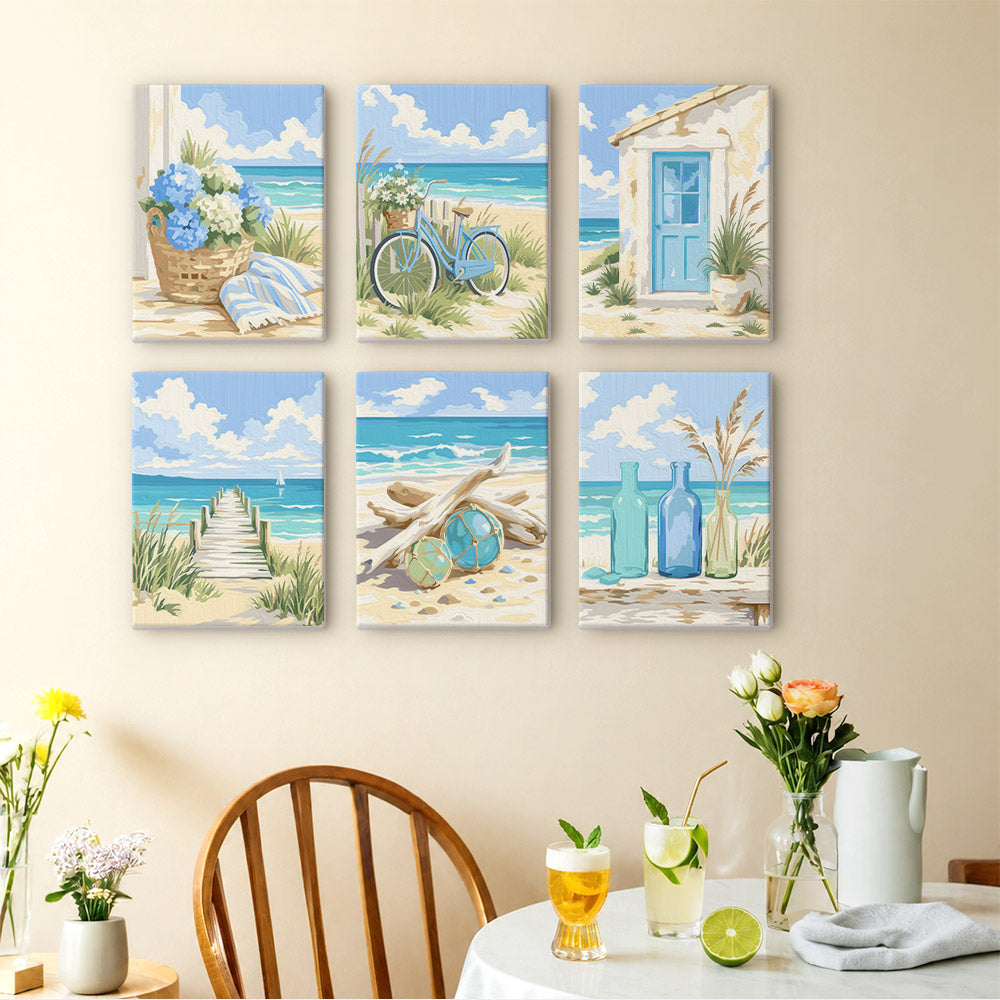 Coastal Whites mini paintings displayed as a gallery wall in a sunny kitchen