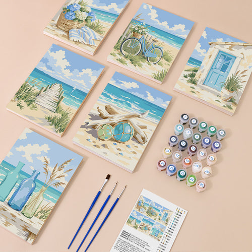 Coastal Whites mini paint by numbers kit with six numbered canvases, acrylic paints, brushes and layout