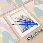 Numbered paint pots and brushes on a pre-stretched Color Block Ladies mini canvas