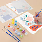 Filling in a Confetti Petals mini canvas with numbered acrylic paints and a fine brush