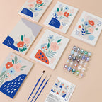 Confetti Petals mini paint by numbers kit with six numbered canvases, acrylic paints, brushes and layout