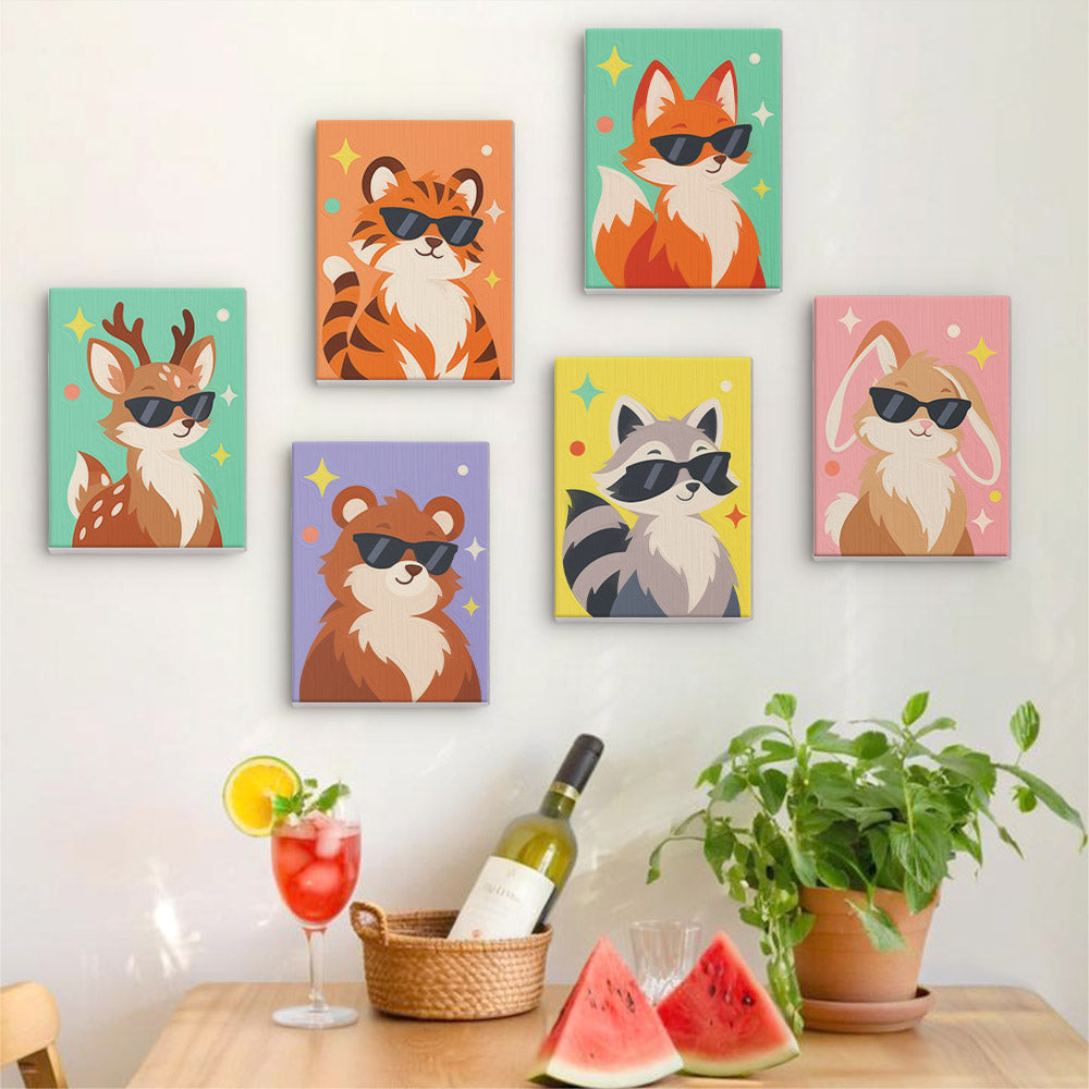 Six finished Cool Critters mini paintings hung on a wall above a table