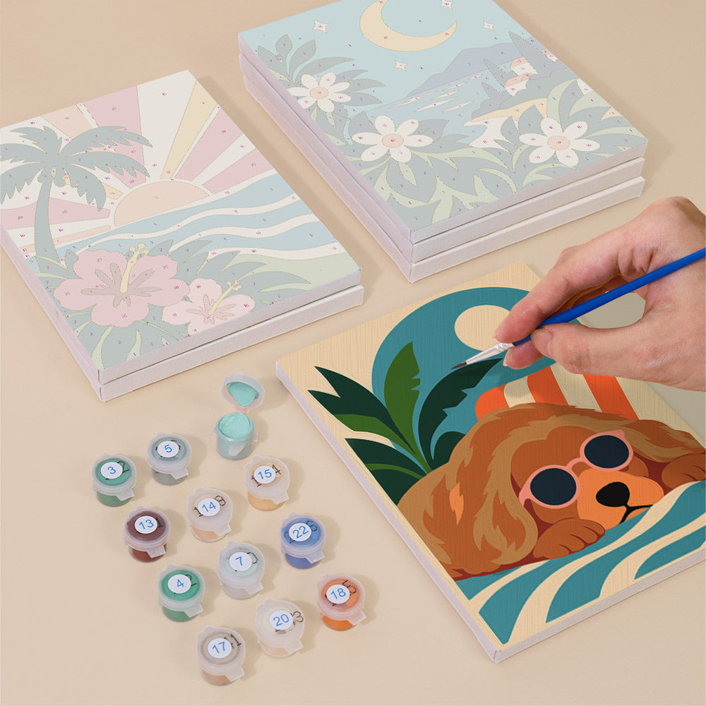 Painting one of the Cool Summer Vibes designs next to a stack of mini canvases