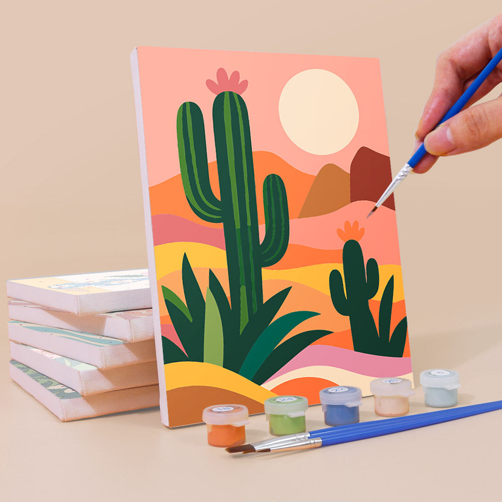 Painting a Cool Summer Vibes mini canvas propped up beside numbered acrylic paints