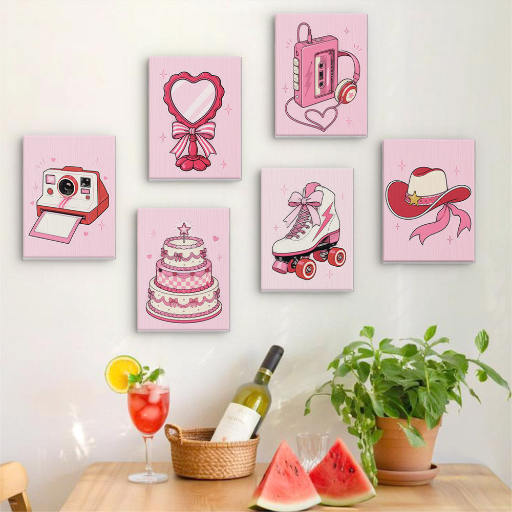Coquette Keepsakes mini canvases hung on a wall above a table with summer drinks