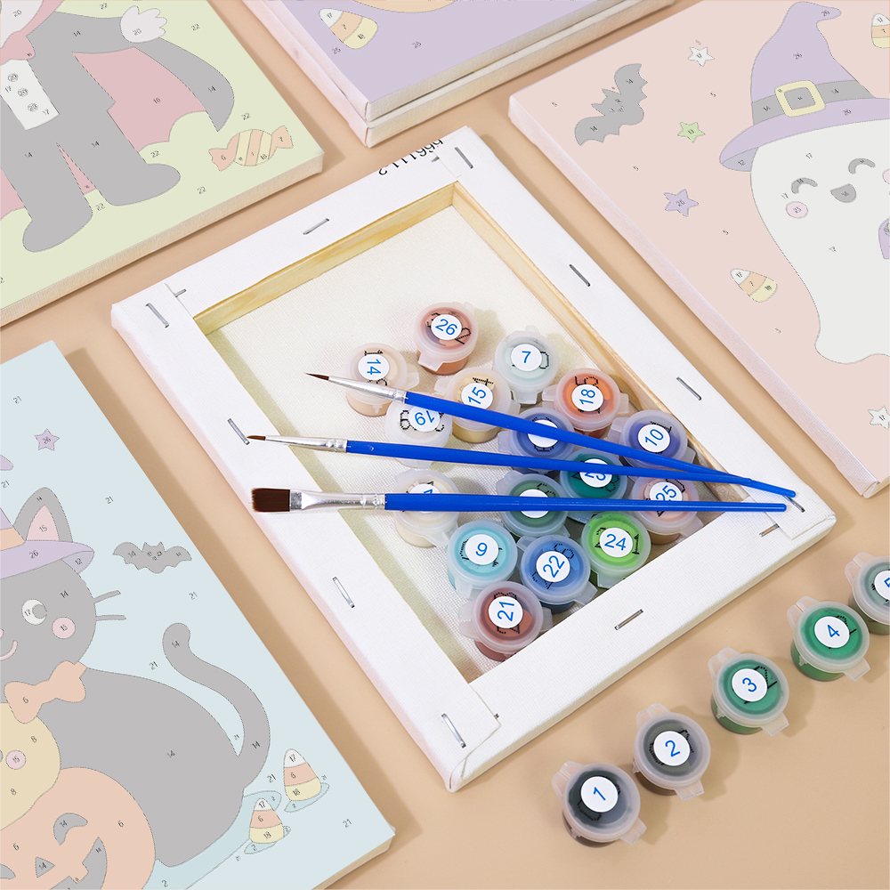 Numbered paint pots and brushes on a pre-stretched Costume Cuties mini canvas