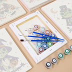 Costumed Frog Friends mini paintings displayed as a gallery wall in a sunny kitchen