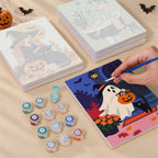 Painting one of the Cozy Autumn Spooks designs next to a stack of mini canvases