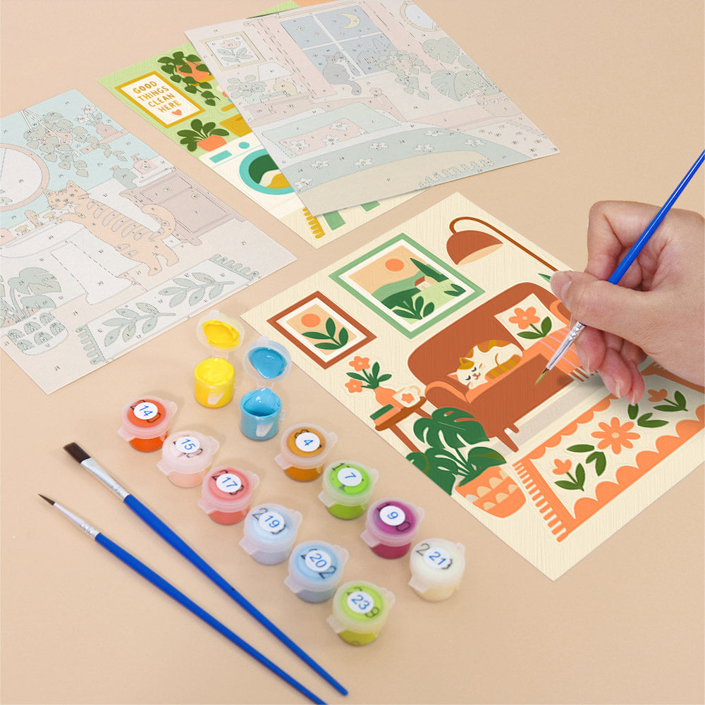 Filling in a Cozy Cat Home mini canvas with numbered acrylic paints and a fine brush