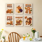 Cozy Fall mini paintings displayed as a gallery wall in a sunny kitchen