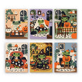 Cozy Frog Halloween mini paint by numbers set: six cozy scenes of a little frog celebrating Halloween at home with ghost cookies, blankets, spellbooks and pumpkins